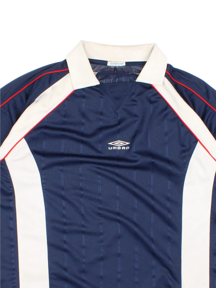 Vintage Y2K Umbro Training Top in a blue and white colourway, has a collar and the logo embroidered on the front.