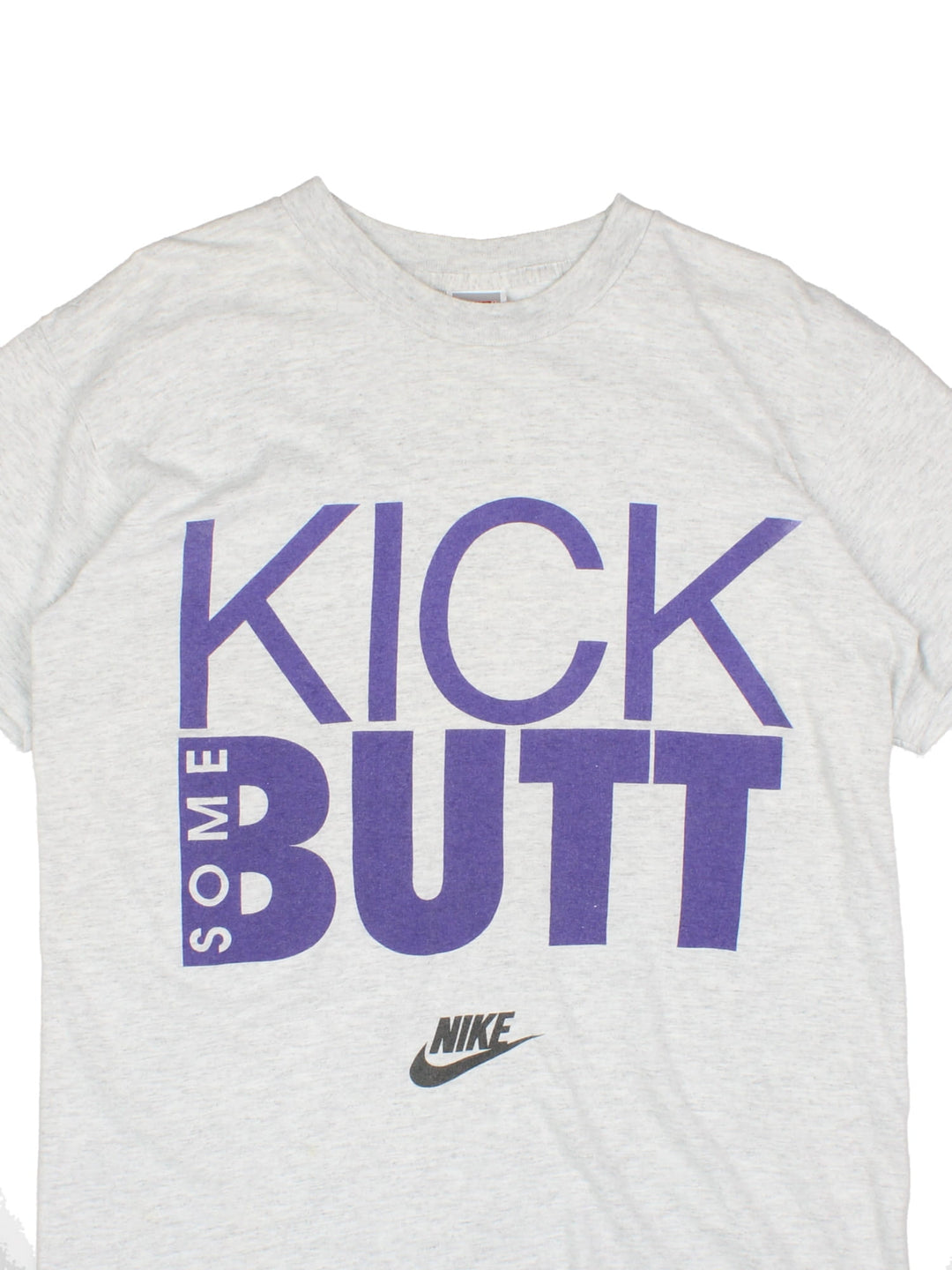 Vintage Nike T-Shirt in a grey colourway with 'Kick Some Butt' spell out and the logo printed on the front.