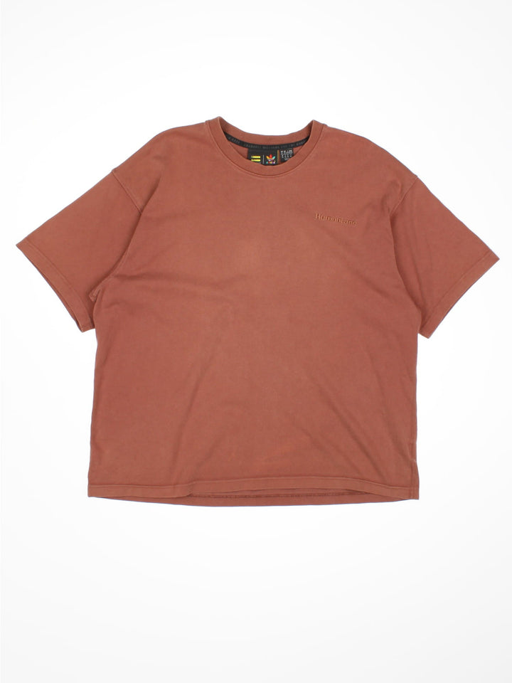 Adidas Humanrace by Pharrell Williams Basics T-Shirt in a brown colourway with the spell out logo embroidered on the front.