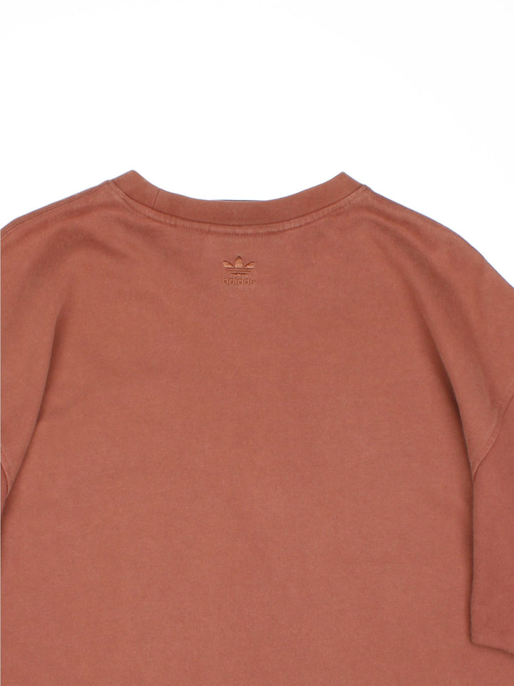 Adidas Humanrace by Pharrell Williams Basics T-Shirt in a brown colourway with the spell out logo embroidered on the front.