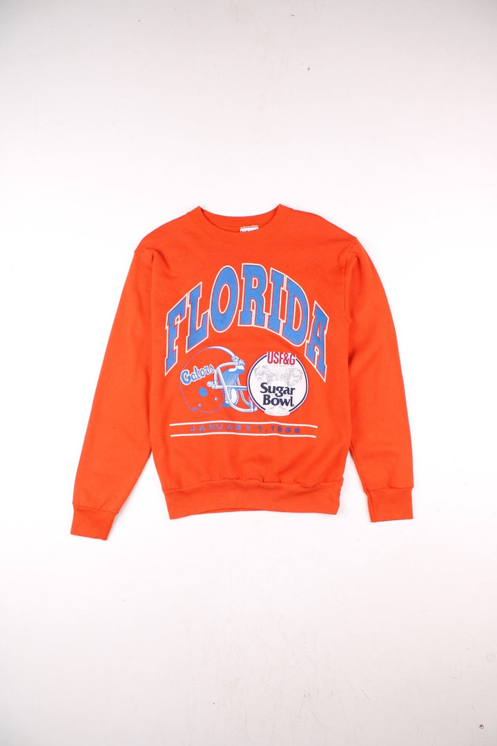 1992 Florida Gators Sugar Bowl sweatshirt in orange with printed graphic on the front in blue and white, and text reading 'Florida Gators Sugar Bowl USF&G, January 1, 1992'.