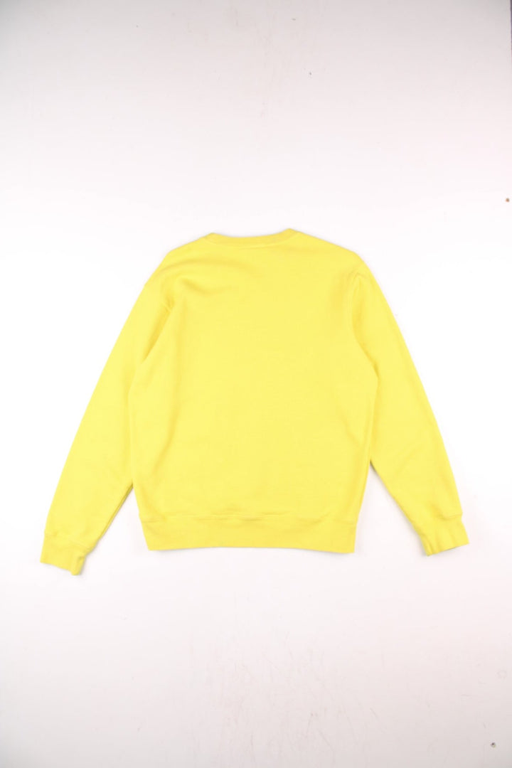 Supreme Underline sweatshirt in yellow with a printed spellout in black and red on the front.