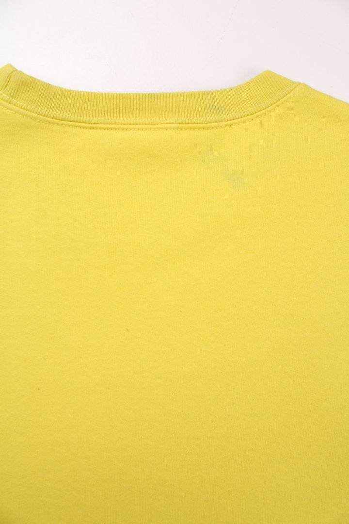 Supreme Underline sweatshirt in yellow with a printed spellout in black and red on the front.