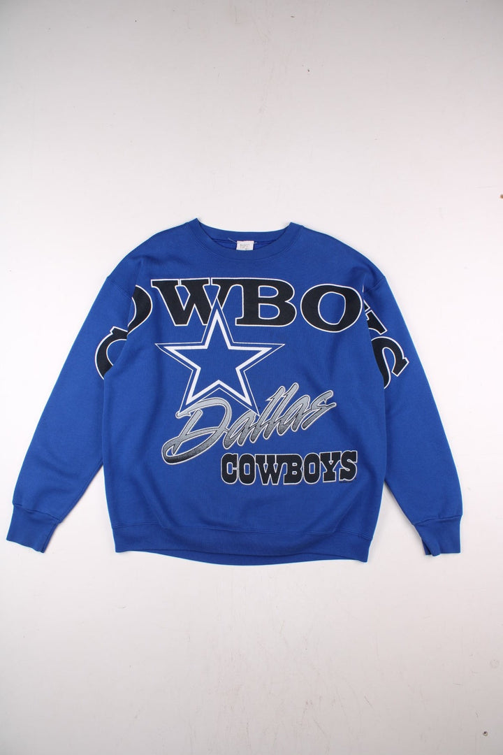 Dallas Cowboys NFL sweatshirt in blue with a large printed graphic spanning the front and sleeves.