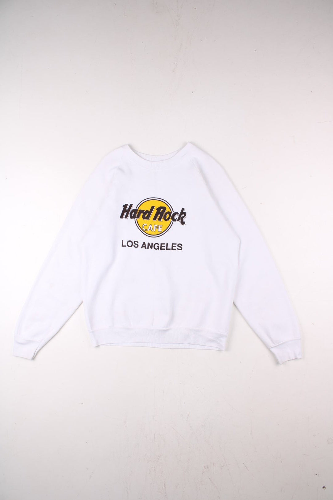 Hard Rock Cafe Los Angeles sweatshirt in white with printed logo graphic on the front in black and yellow.