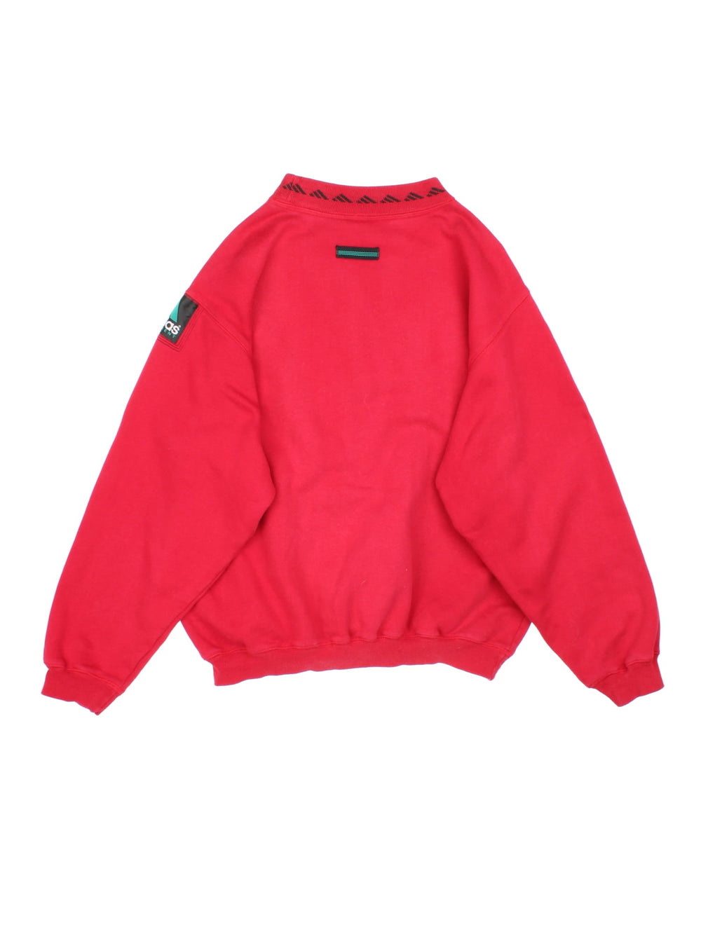 Vintage 1990s Adidas Sweatshirt in a red colourway with the logo embroidered on the front and centre. There is also an Adidas equipment patch sewn onto the sleeve. The sweatshirt has an elasticated graphic printed collar. 