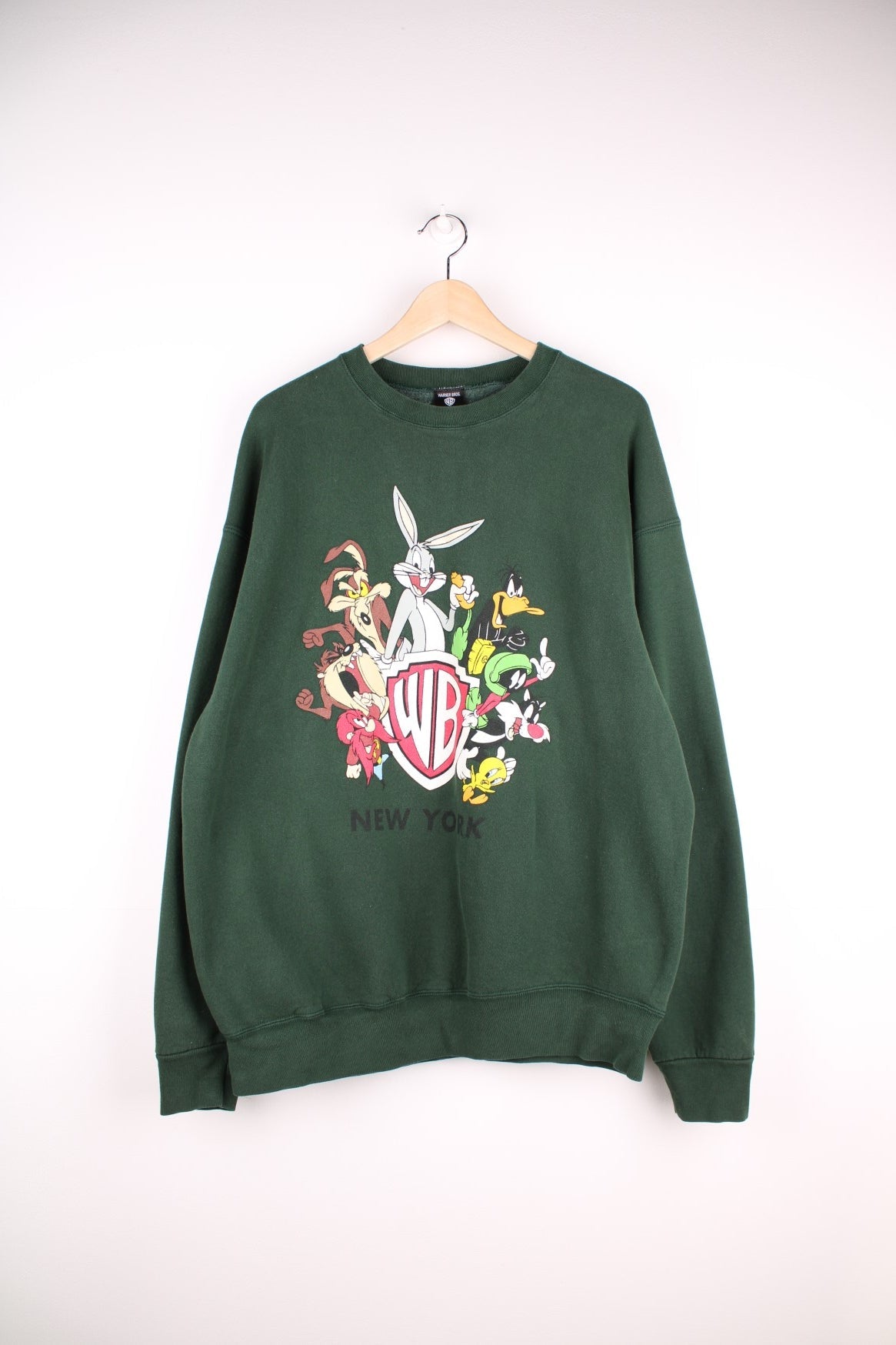 Looney Tunes graphic sweatshirt featuring front and back graphic of all characters around the Warner Brothers crest logo, and &