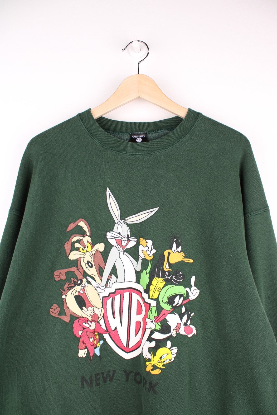 Looney Tunes graphic sweatshirt featuring front and back graphic of all characters around the Warner Brothers crest logo, and &