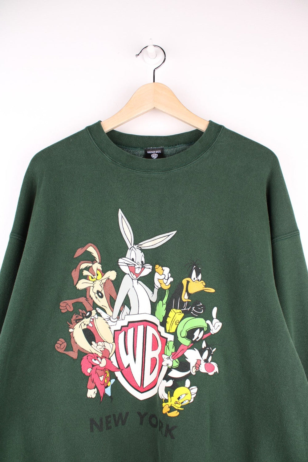 Looney Tunes graphic sweatshirt featuring front and back graphic of all characters around the Warner Brothers crest logo, and 'NEW YORK' written on the back.  