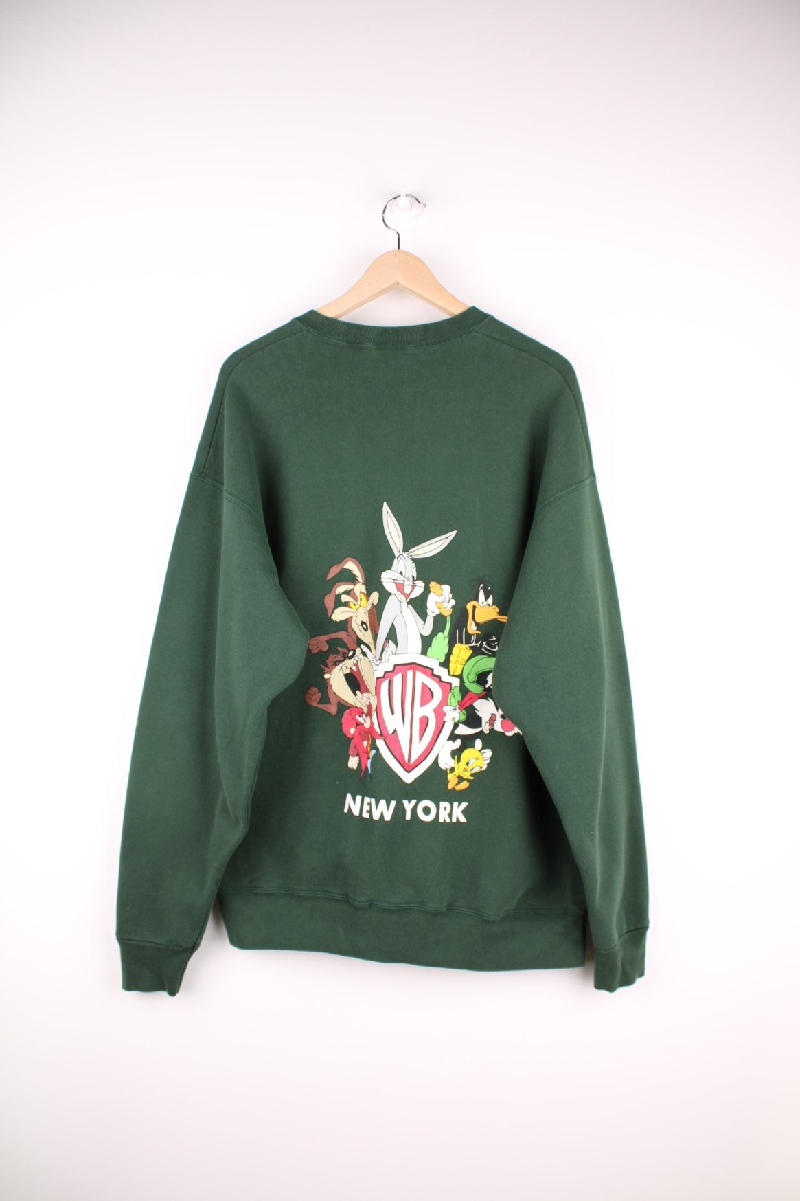 Looney Tunes graphic sweatshirt featuring front and back graphic of all characters around the Warner Brothers crest logo, and &