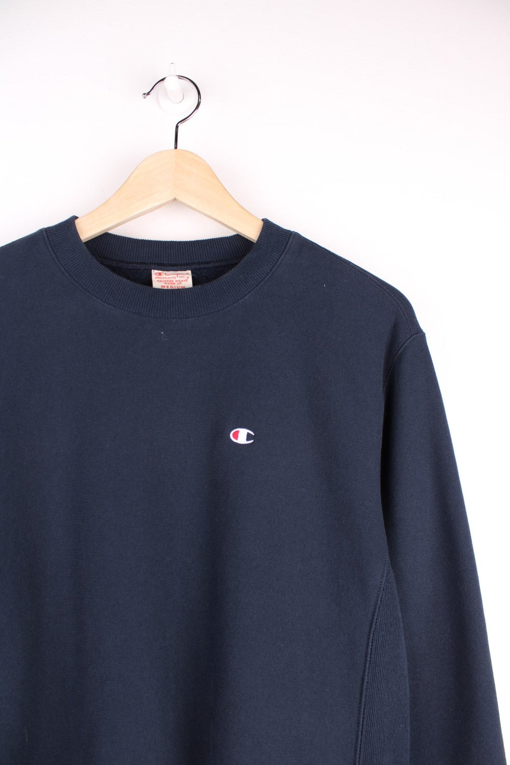 Champion reverse weave 'Warm Up' sweatshirt in navy blue with C logos embroidered on the chest and left cuff. 100% cotton. 