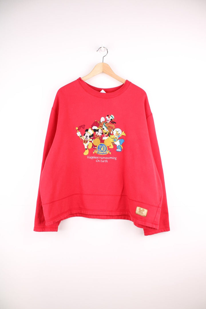 Disneyland 50 Years Happiest Homecoming On Earth cropped sweatshirt in red. 