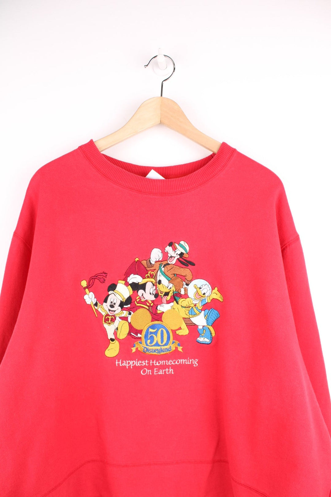 Disneyland 50 Years Happiest Homecoming On Earth cropped sweatshirt in red. 