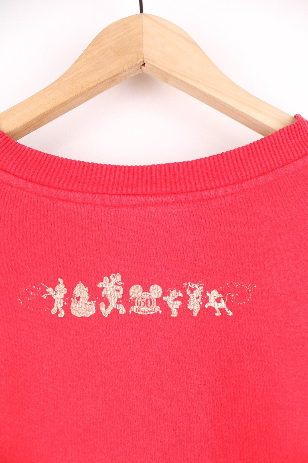 Disneyland 50 Years Happiest Homecoming On Earth cropped sweatshirt in red. 