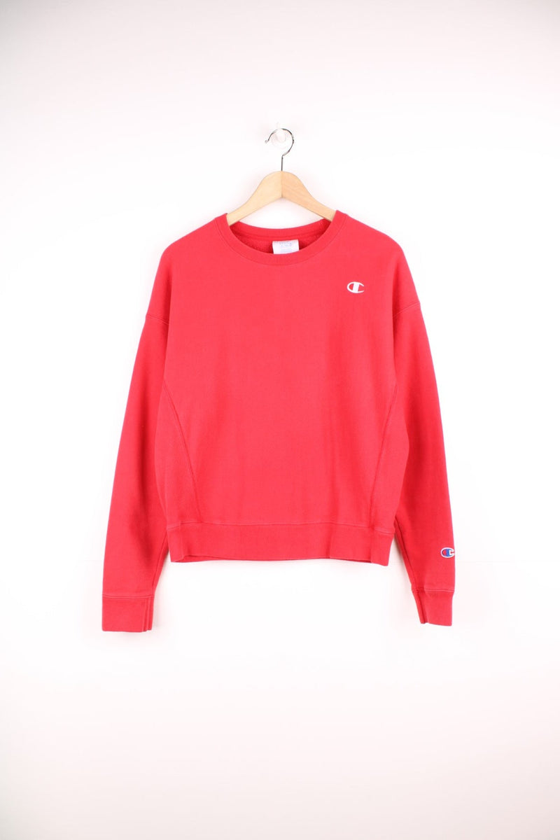 Champion Reverse Weave red sweatshirt with embroidered logo on the chest.