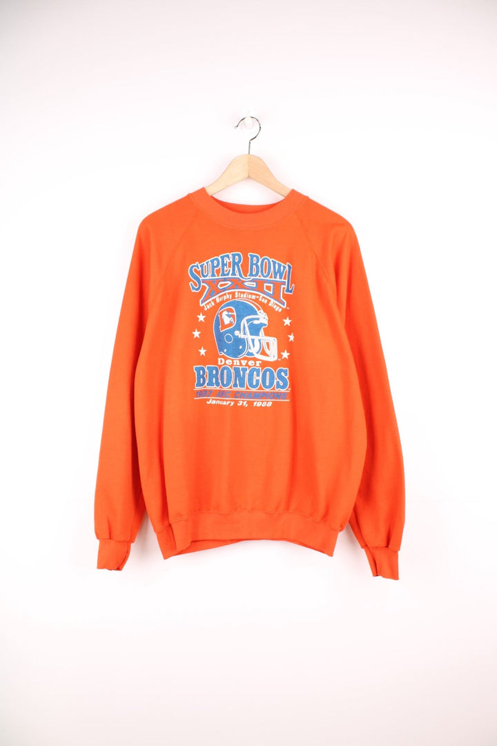 Vintage Denver Broncos, 1987 AFC Champions, Super Bowl sweatshirt in orange and blue.