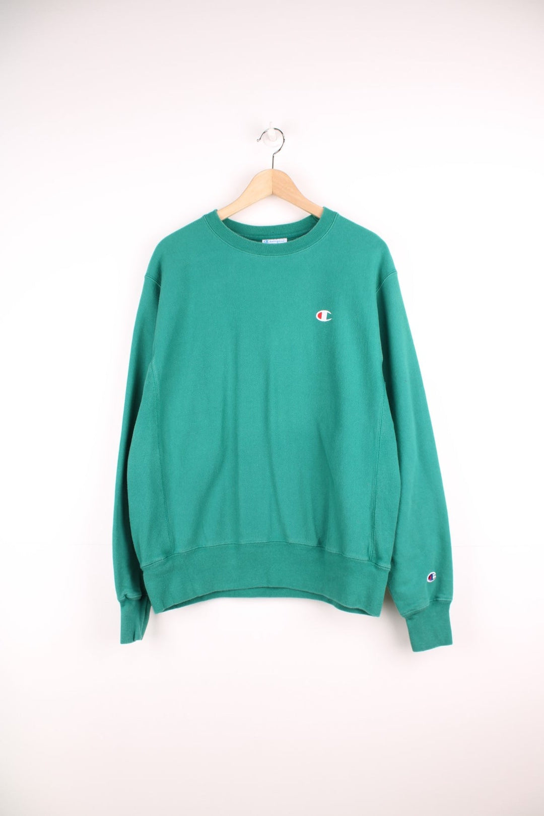 Green Champion Reverse Weave sweatshirt with embroidered logo on the chest.