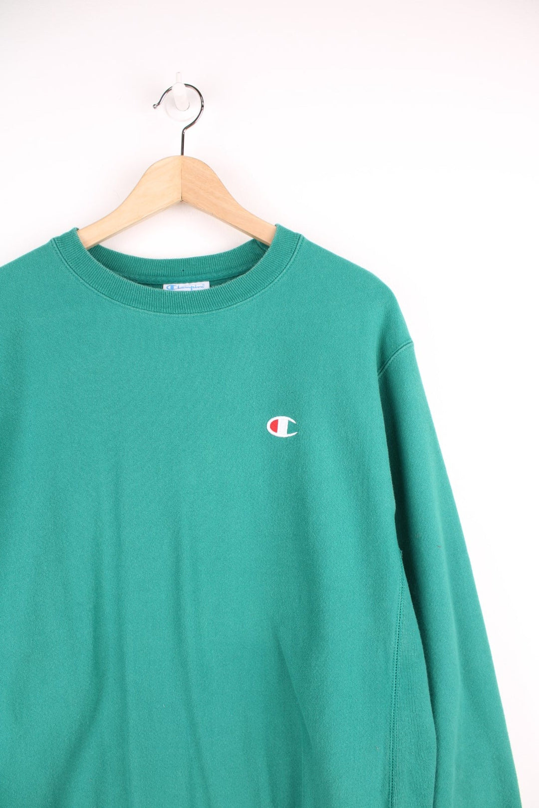 Green Champion Reverse Weave sweatshirt with embroidered logo on the chest.