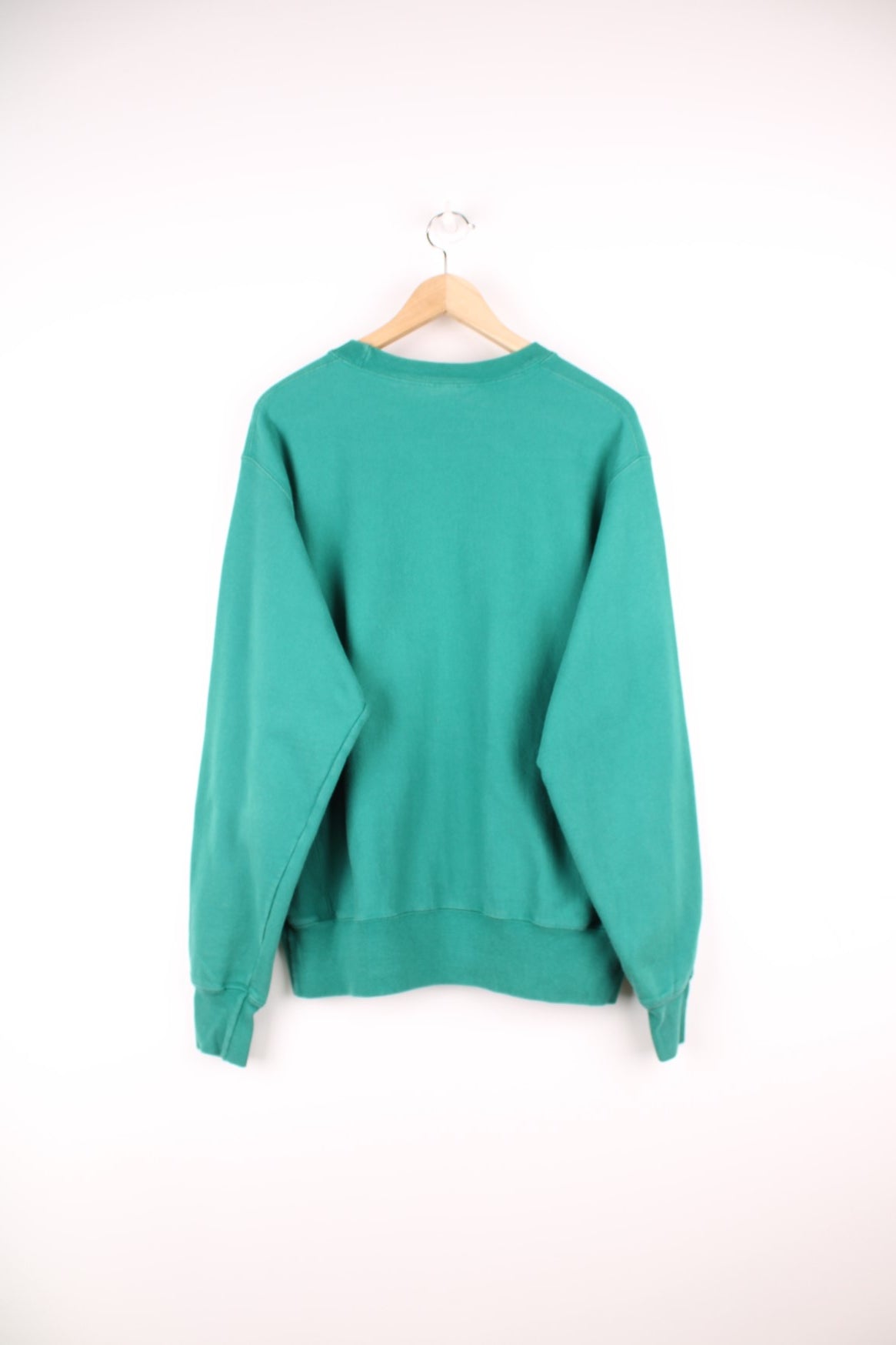 Green Champion Reverse Weave sweatshirt with embroidered logo on the chest.