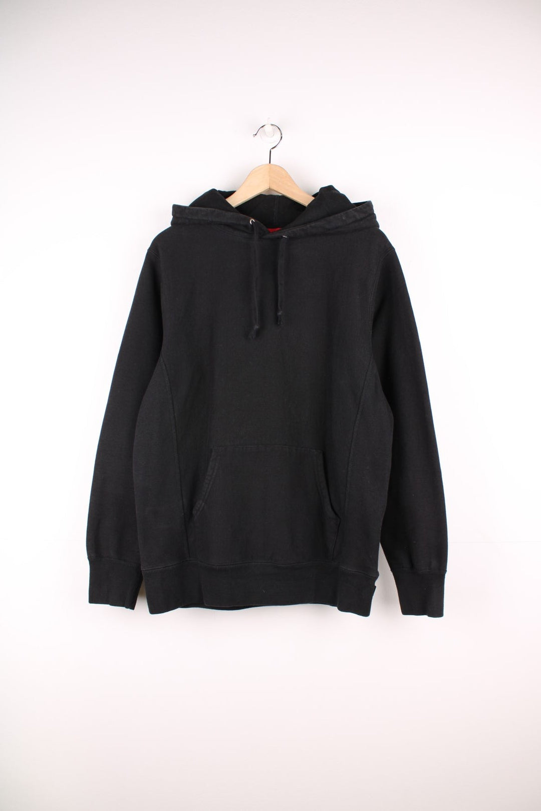 Supreme black classic script hoodie. Features pouch pocket and embroidered spell out logo on the hood.