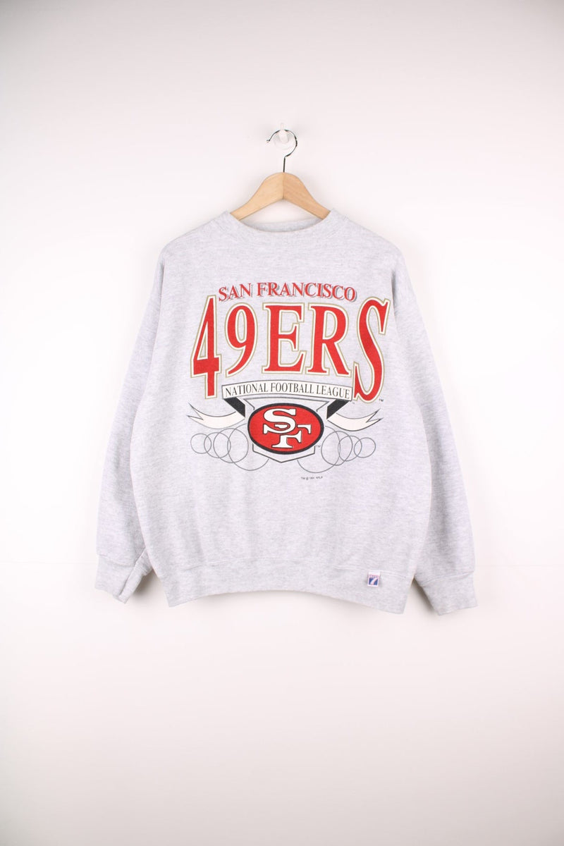 Vintage 90s San Francisco 49ers sweatshirt in grey with printed logo on the front.