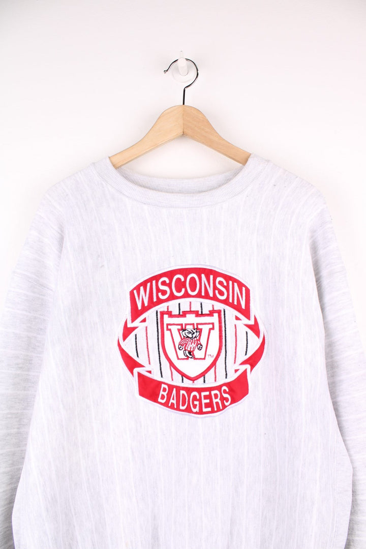 Wisconsin Badgers grey sweatshirt with red embroidered logo on the front.