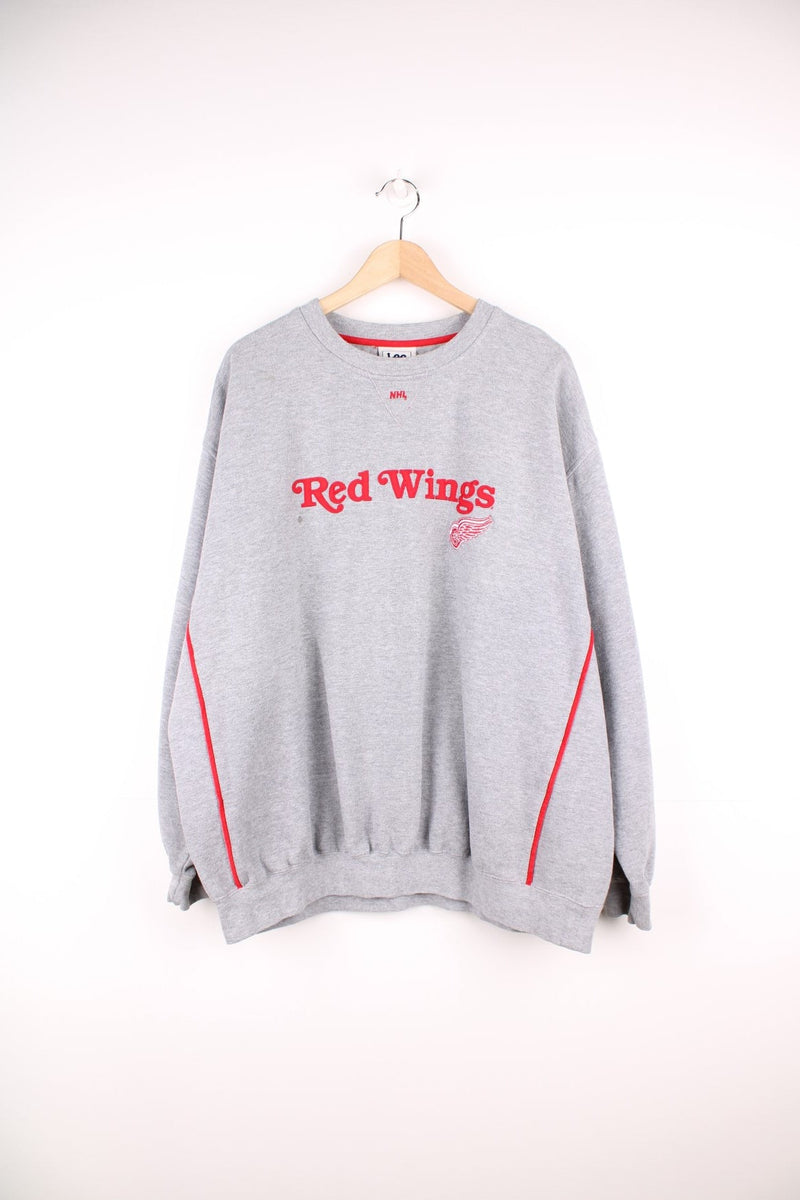 NHL Red Wings sweatshirt in grey by Lee Sport. Features red embroidered spell out logo across the chest.