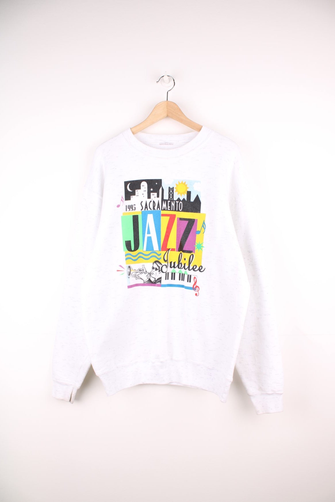 Vintage 1995 Sacramento Jazz Jubilee sweatshirt in white with multi coloured graphic print on the front.