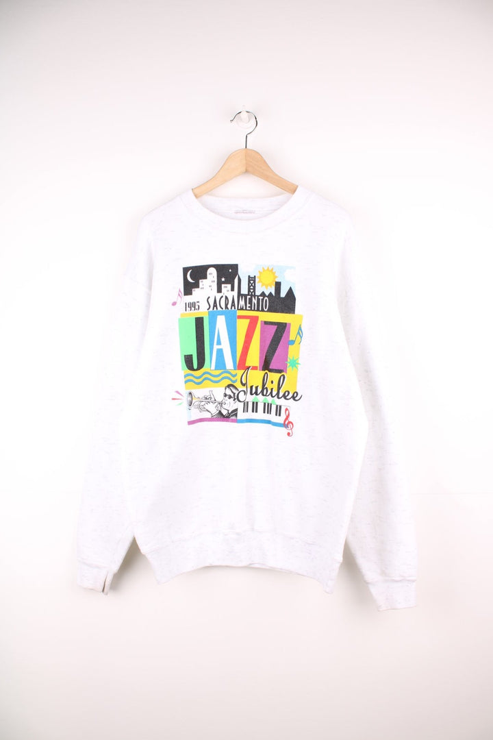 Vintage 1995 Sacramento Jazz Jubilee sweatshirt in white with multi coloured graphic print on the front.