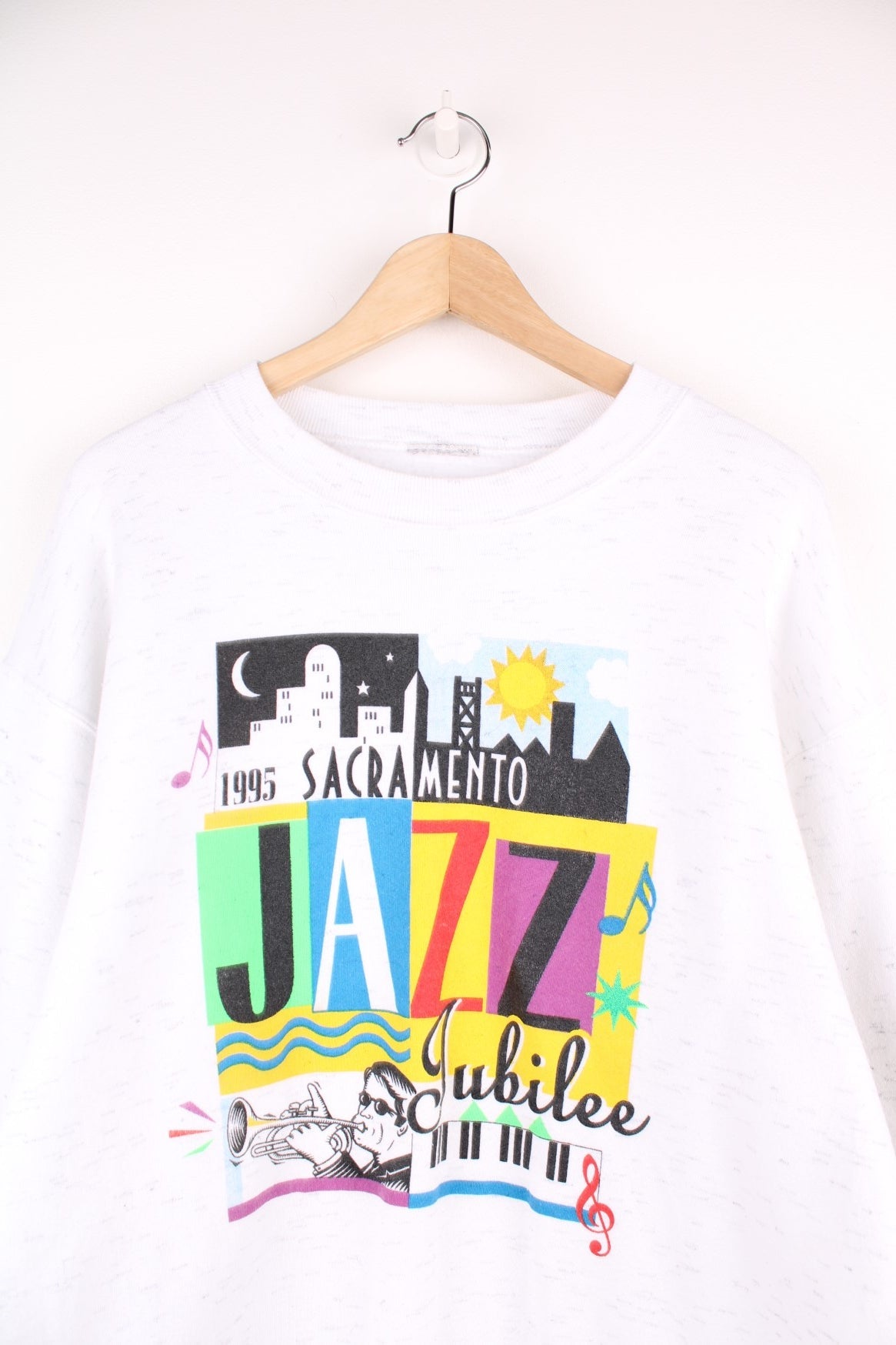 Vintage 1995 Sacramento Jazz Jubilee sweatshirt in white with multi coloured graphic print on the front.