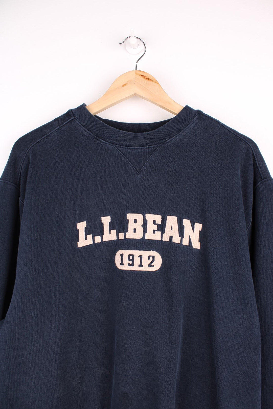  L.L Bean sweatshirt in a navy blue featuring a large embroidered logo across the chest.