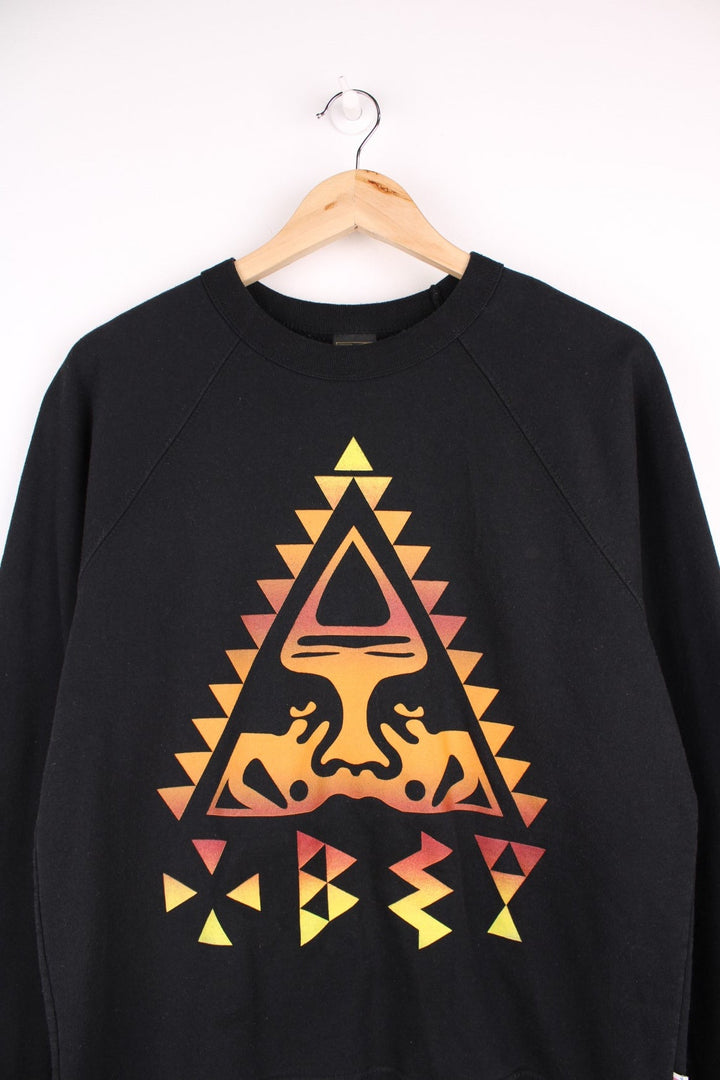  Y2K Obey crewneck in black featuring a large aztec-style print logo and classic eyes icon across the chest.