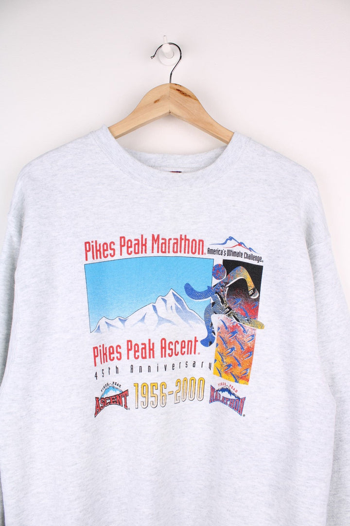 Pikes Peak Ascent 45th Anniversay Fruit of the Loom Sweatshirt in grey marl with the marathon logos and a mountain graphic printed across the chest.