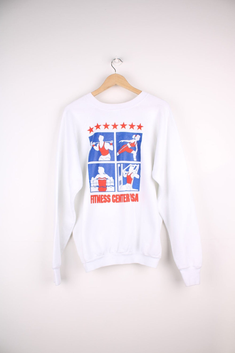  Fruit of the Loom 'Fitness Centre USA' Sweatshirt in white with a printed logo and red and blue sporty graphics on the front and across the back.