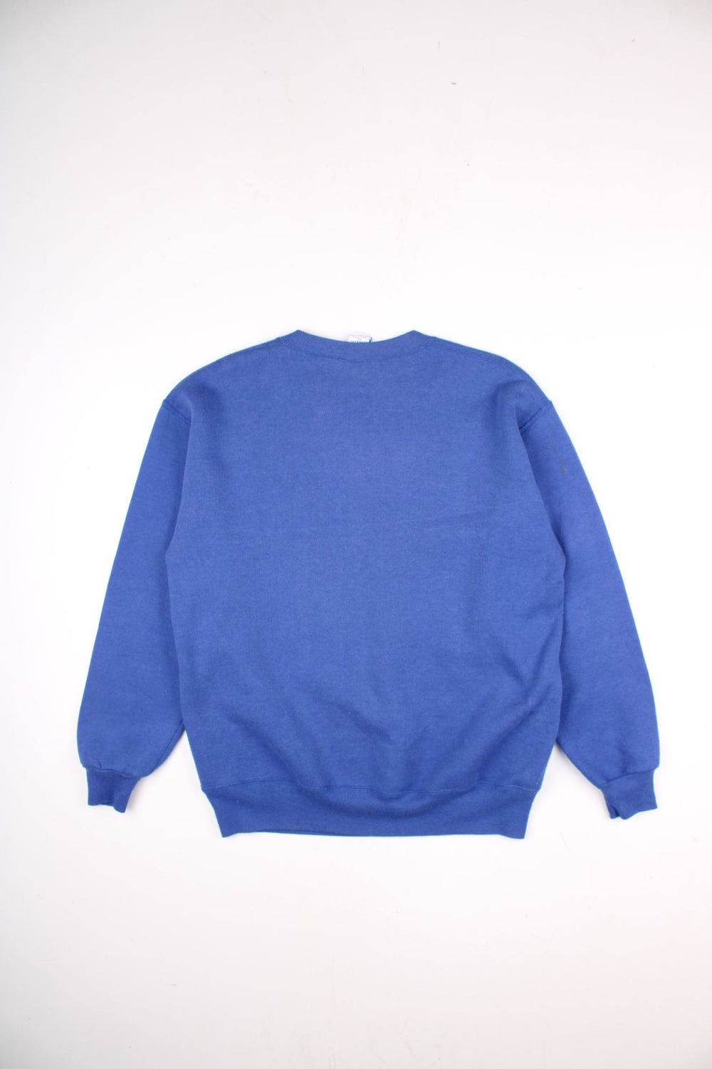 Vintage Russell Athletic Sweatshirt in a blue colourway with the New York Giants logo screenprinted on the front. Label dates the sweatshirt to the 90s, made in the USA. 