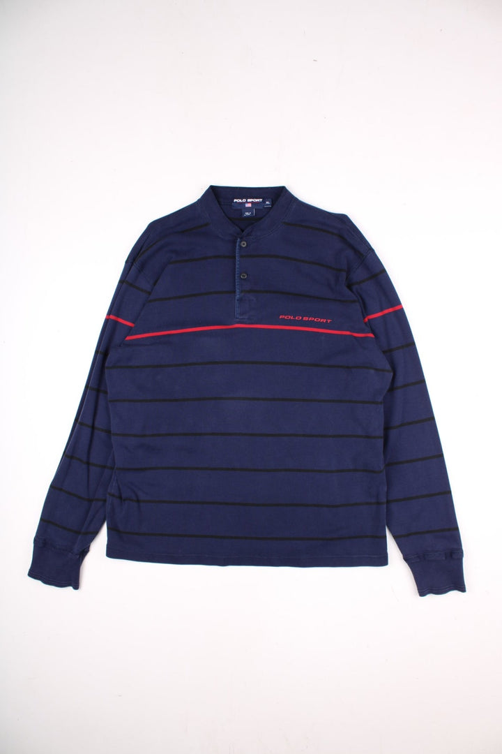 Vintage Ralph Lauren Polo Sport long sleeved Polo Shirt in a navy blue colourway with a small polo sport logo on the front, and red stripe running across the chest and arms. The shirt has a grandfather collar with two buttons to close. 