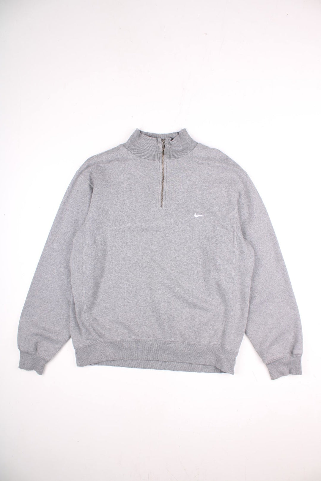 Vintage Nike 1/4 zip sweatshirt in a grey colourway with a small nike logo embroidered on the front. 