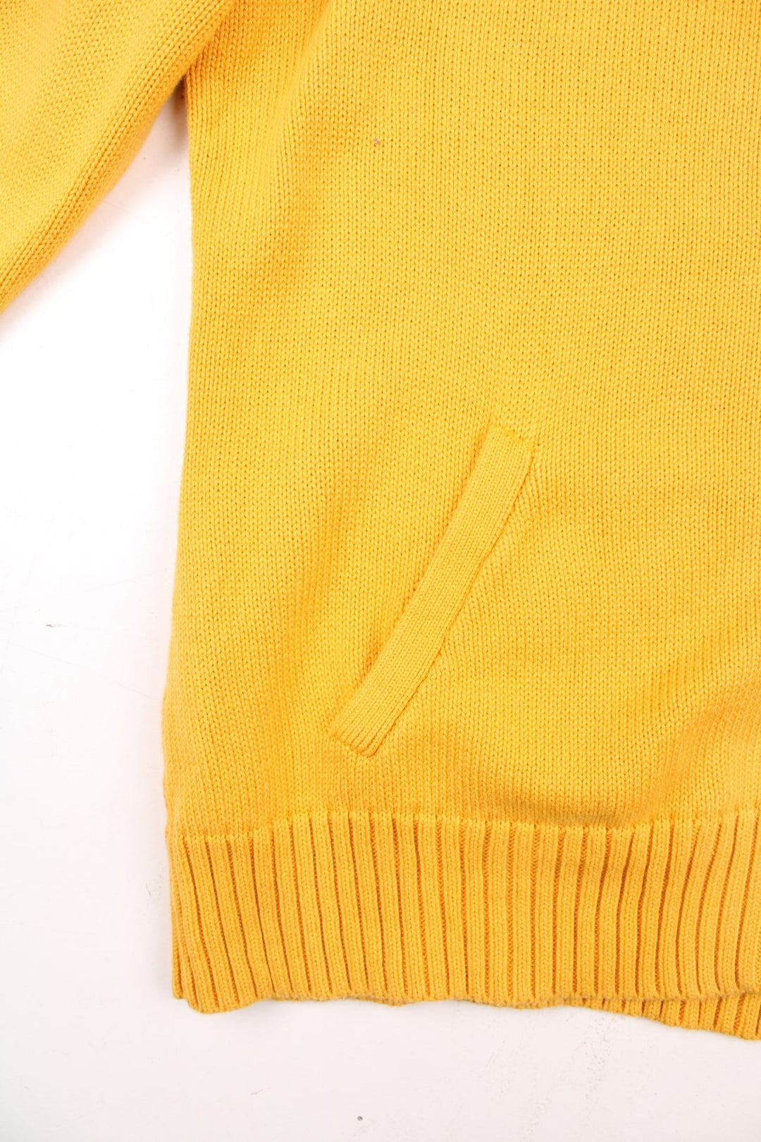 Ralph Lauren Sport zip cardigan in a mustard yellow colourway with the Ralph Lauren logo embroidered on the front chest panel. The knit has a cable knit pattern down the sleeves, ands two front pockets.