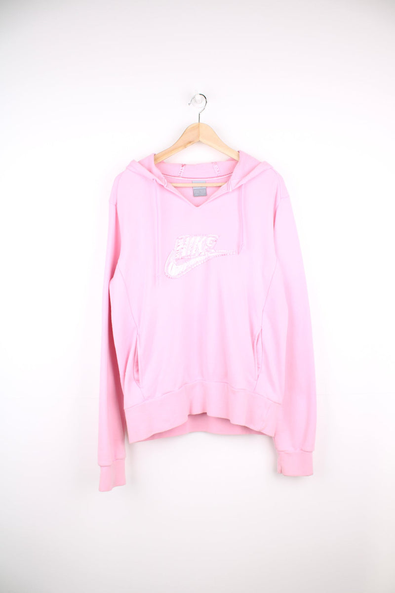 Pink Nike hoodie with embroidered satin logo across the chest.