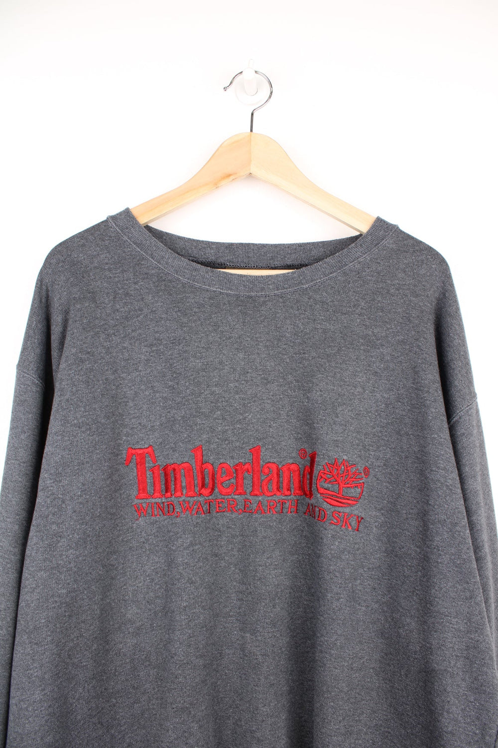 Grey Timberland sweatshirt with red embroidered logo across the chest.