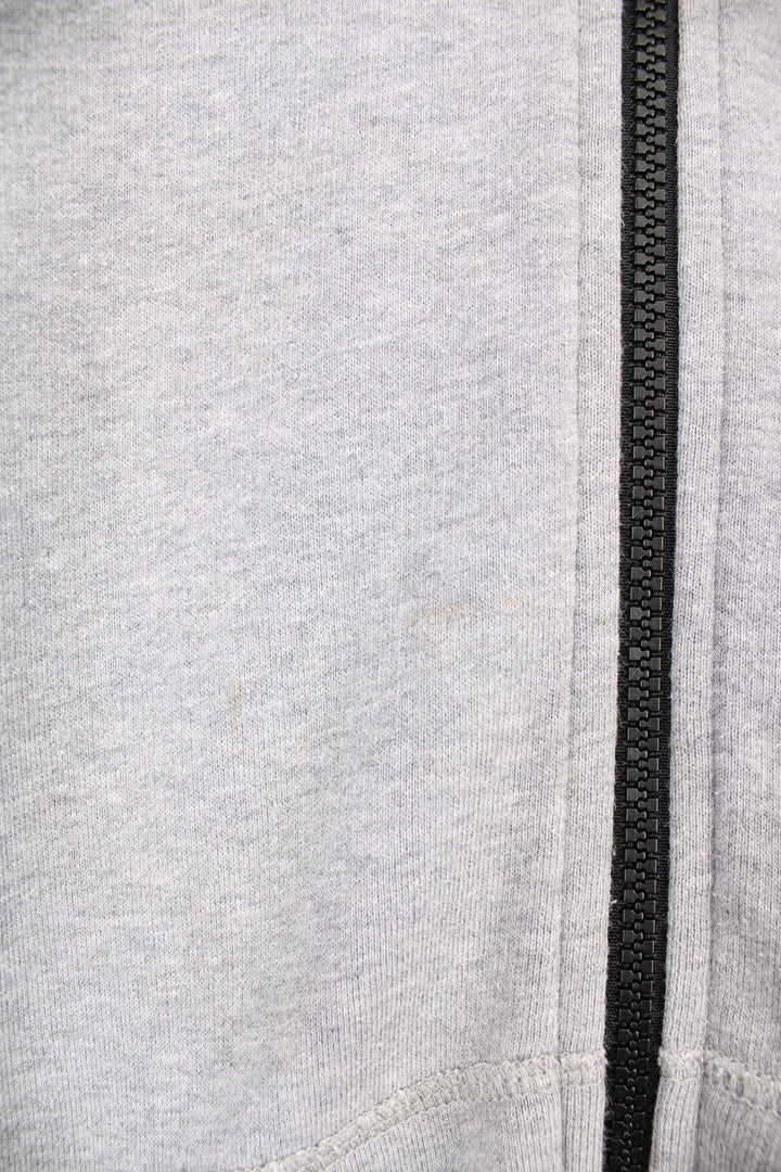 CP Company grey zip through hoodie with goggles and printed logo on the chest.