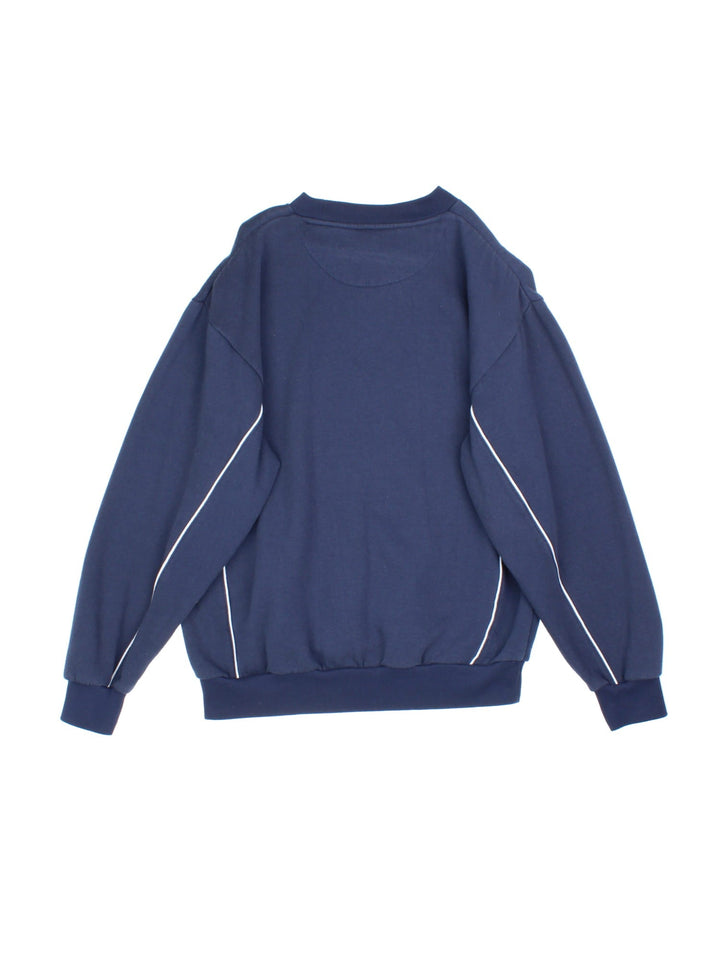 Vintage Umbro Sweatshirt in a blue colourway with white stripe detailing and small classic logo on the front.