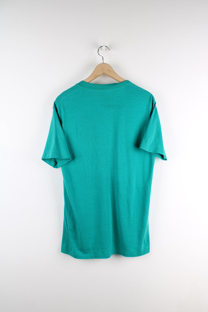 90s Nike turquoise single stitch t-shirt, features printed spell-out logo across the chest