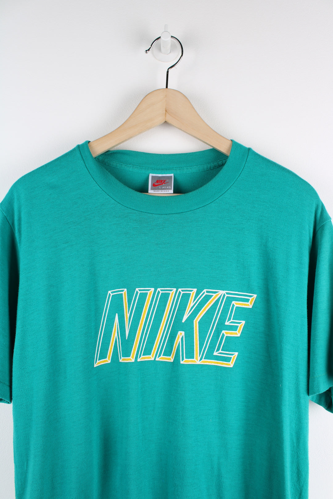 90s Nike turquoise single stitch t-shirt, features printed spell-out logo across the chest