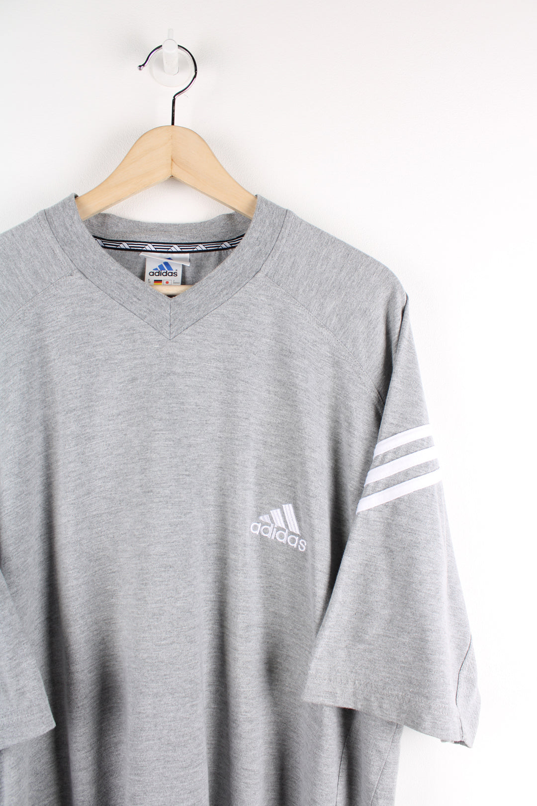 90's Adidas grey t-shirt, features embroidered logo on chest and signature three stripes on the sleeve