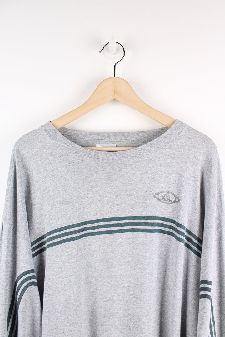 Adidas Performance grey long-sleeve t-shirt, features printed three stripe details across the chest and down the sleeves