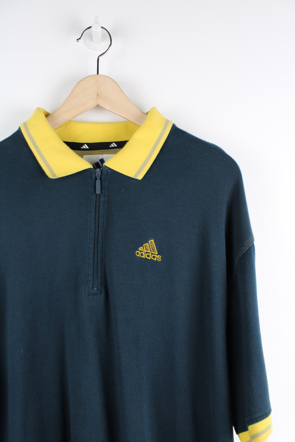 Vintage 90s Adidas navy blue polo shirt with embroidered logo on chest and zip up collar