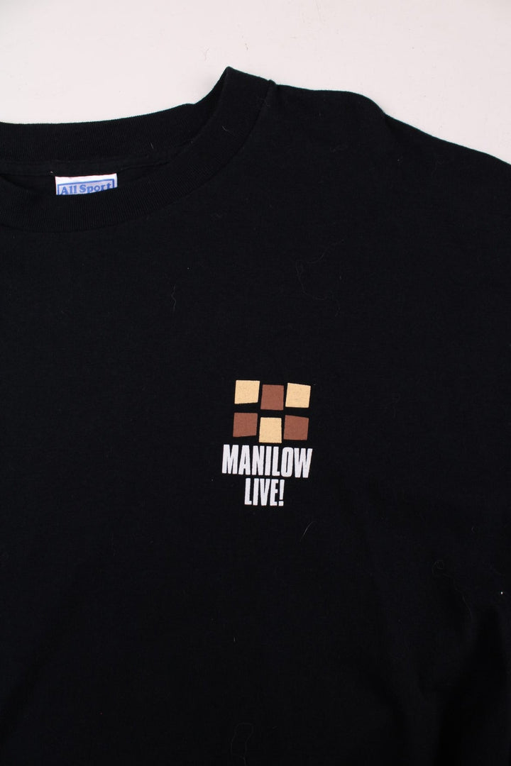 Vintage Barry Manilow Live! Tour Crew T-Shirt in a black colourway with the logo printed on the front, and 'crew' spell out on the left sleeve.