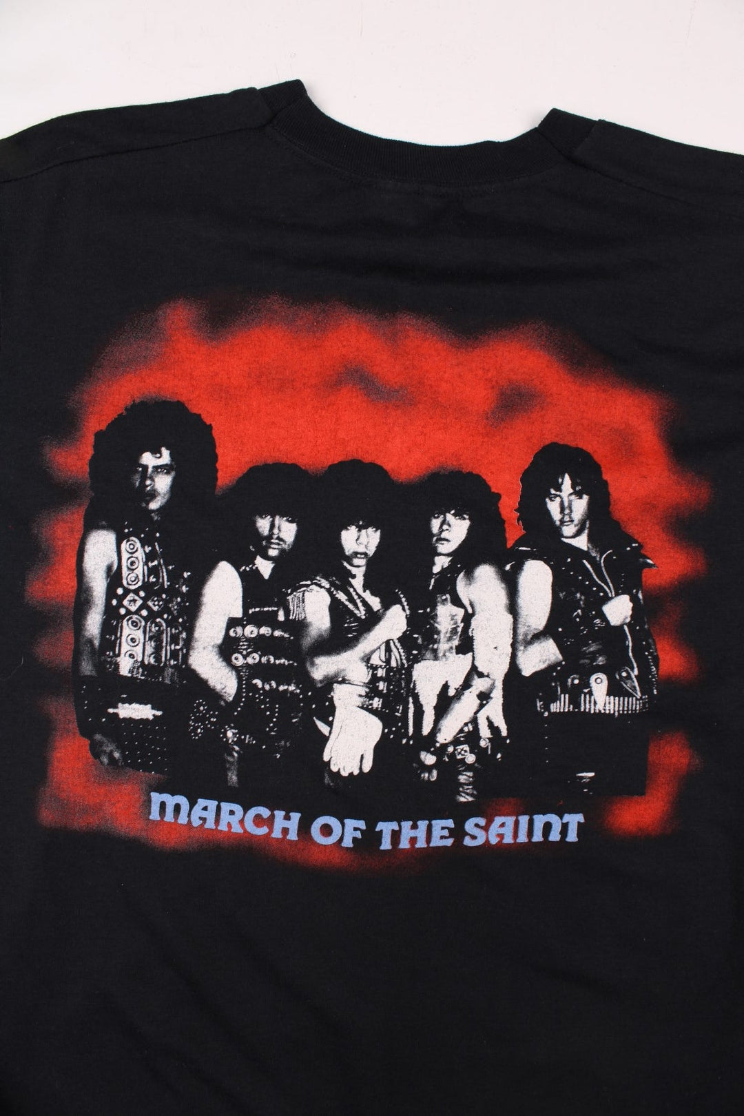 Vintage 80's Armored Saint March Of The Saint single stitch T-Shirt in a black colourway with a medieval knights graphic printed on the front, and the bands pictured and spell out printed on the back.