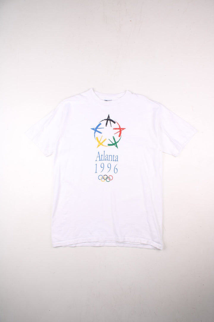 Vintage 1996 Atlanta Olympics single stitch graphic T-Shirt in a white colourway with the logo and graphic printed on the front.